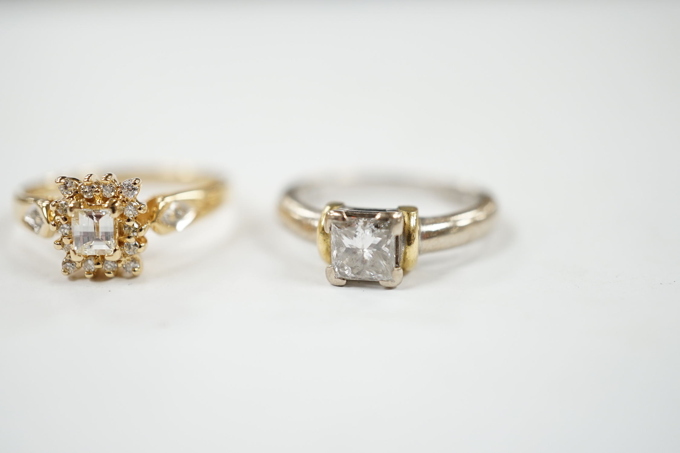 A modern two colour 18ct gold and solitaire princess cut diamond set ring, size K/L and one other modern 18ct gold and diamond set cluster ring, size N, gross weight 7.6 grams.